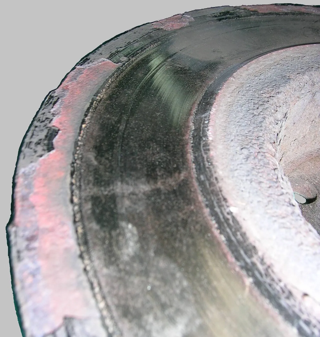 Worn brake rotor being replaced on a vehicle during mobile service in San Antonio